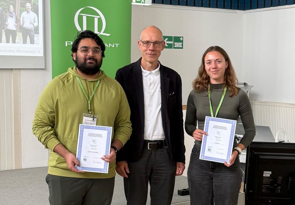 Two studend award winners Eva Münzel and Ayush Kumar Ganguli with Rainer Erdmann
